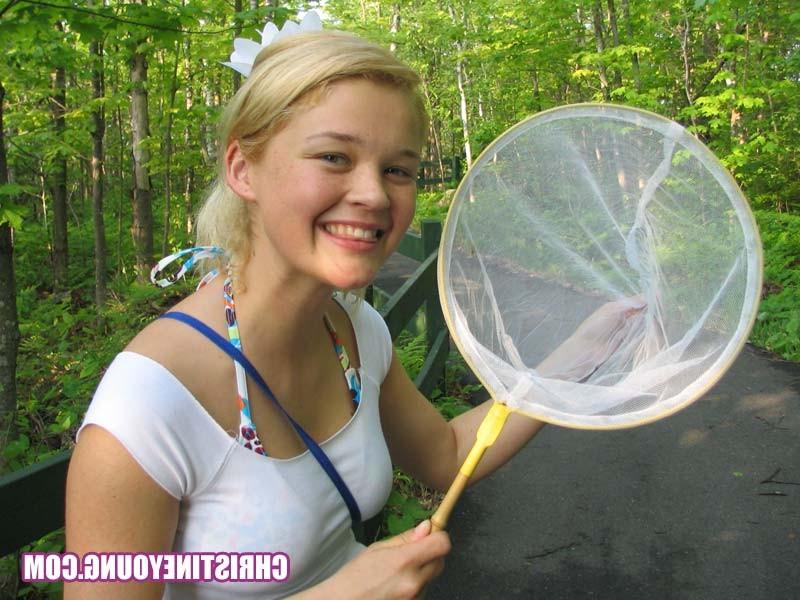 15P Blonde cutie flashing her boobs and having fun outdoors