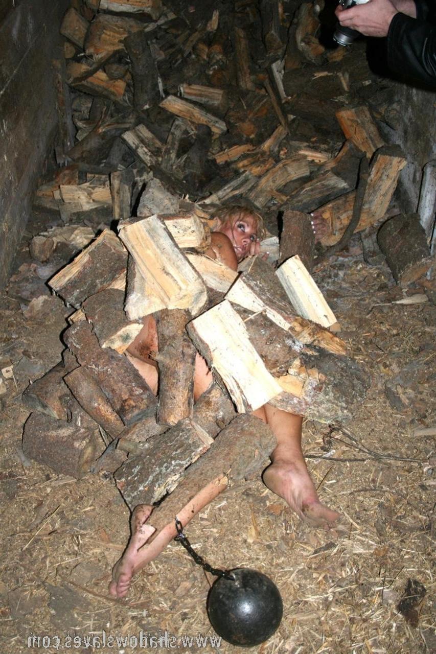 15P Filthy slave labour of blonde subbie chopping wood