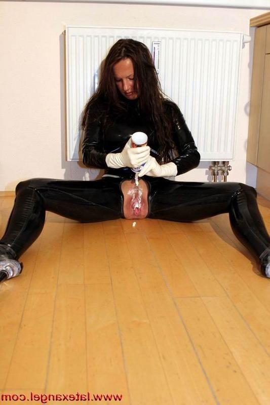 15P Latex Angel inserts a whisk in her twat