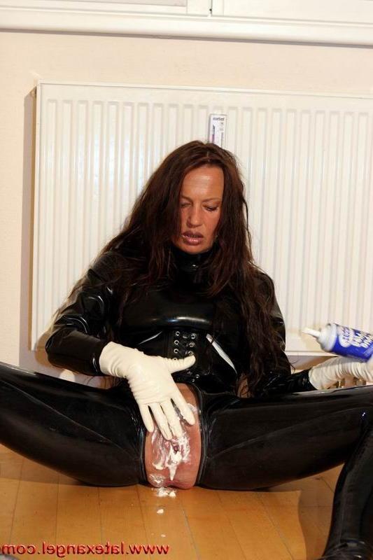 15P Latex Angel inserts a whisk in her twat