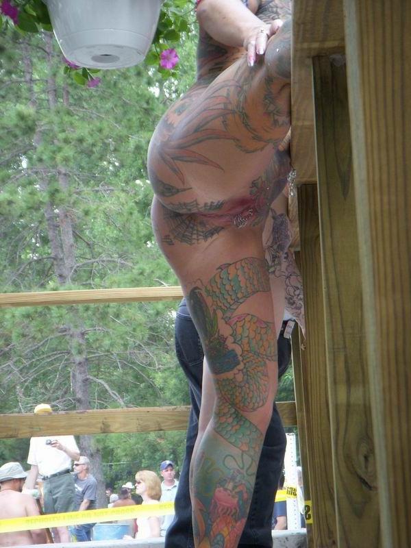 15P Busty tattoed and pierced mature showing off in the public