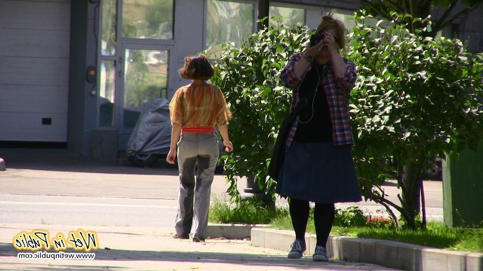 16P Desperate lady relieves herself on the move wetting her jeans in a park