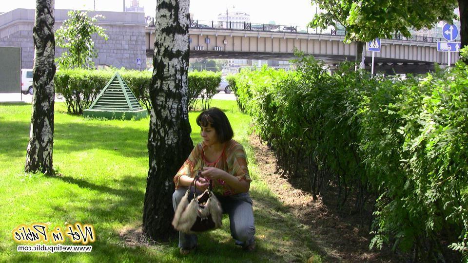 16P Desperate lady relieves herself on the move wetting her jeans in a park
