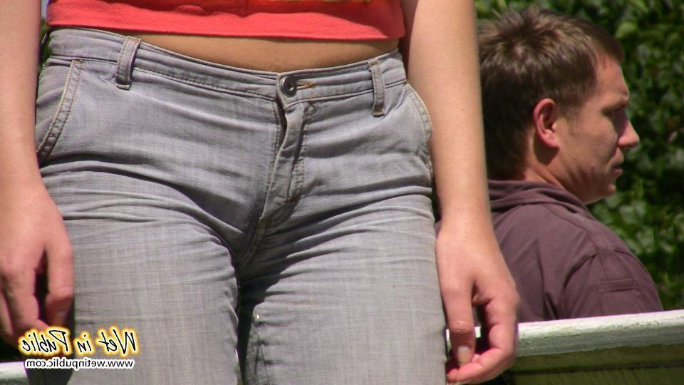 16P Desperate lady relieves herself on the move wetting her jeans in a park