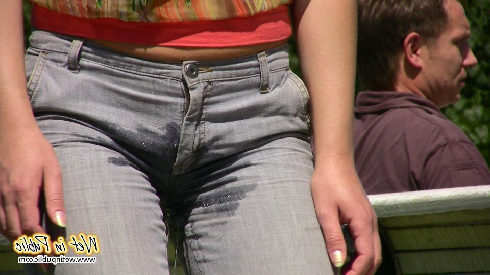 16P Desperate lady relieves herself on the move wetting her jeans in a park