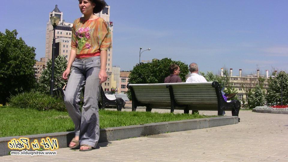 16P Desperate lady relieves herself on the move wetting her jeans in a park