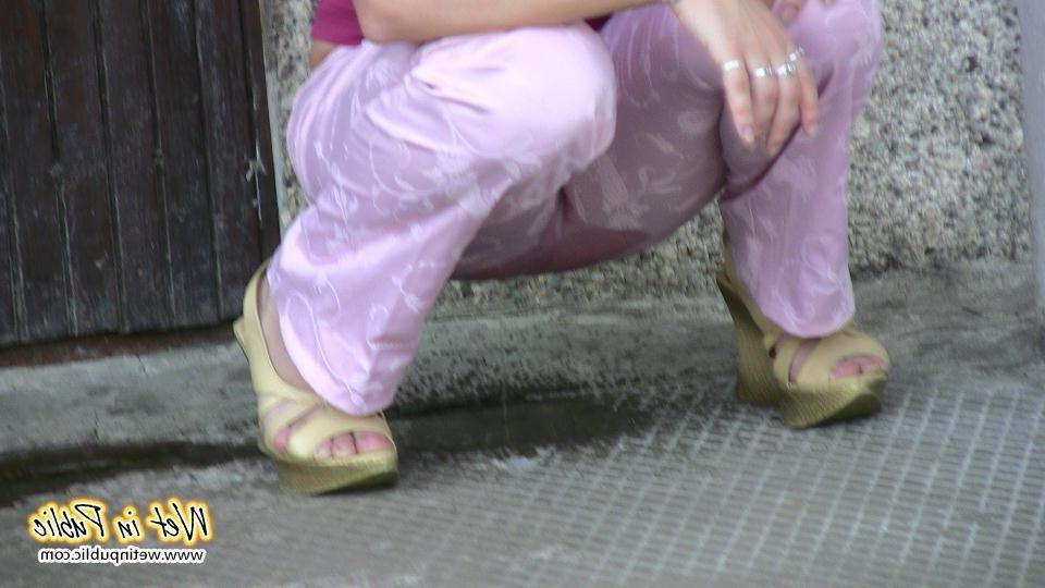 16P Chick wets herself in the corner right by her apartment building door