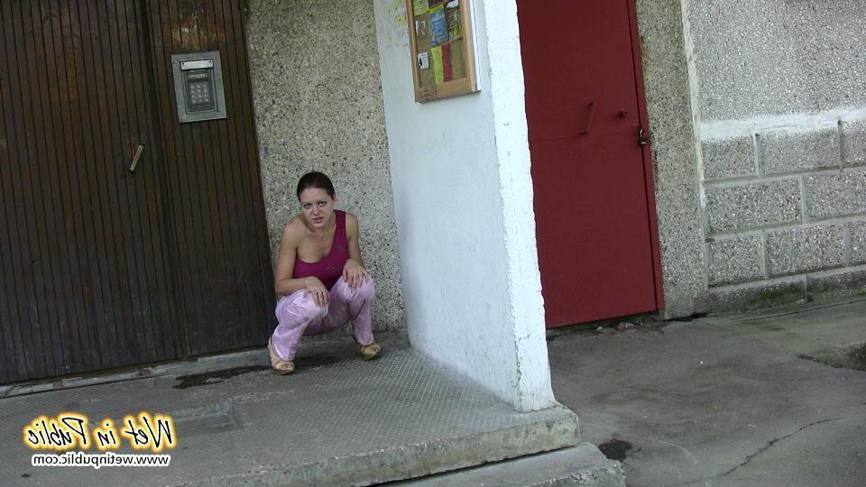 16P Chick wets herself in the corner right by her apartment building door