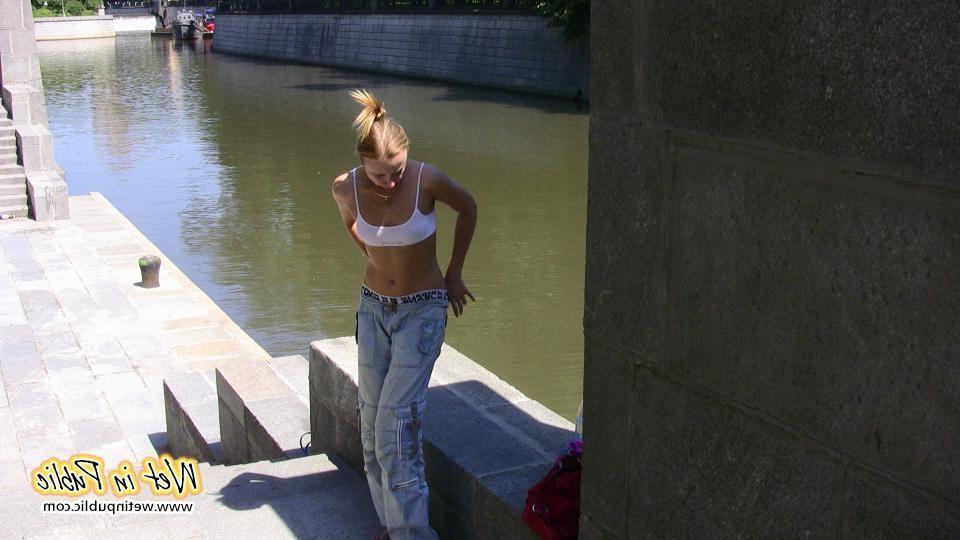 16P Amateur gal in sporty top squats down and pees right through her pants