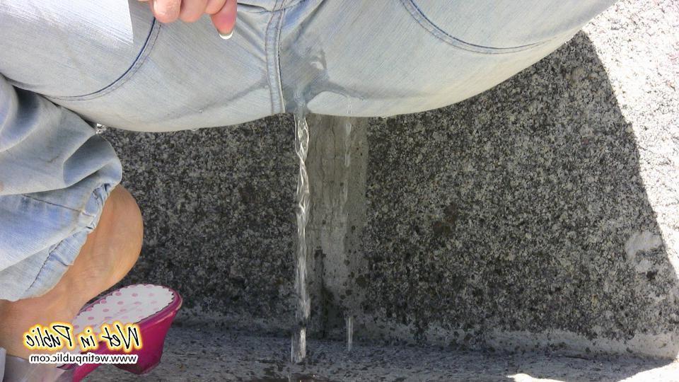 16P Amateur gal in sporty top squats down and pees right through her pants