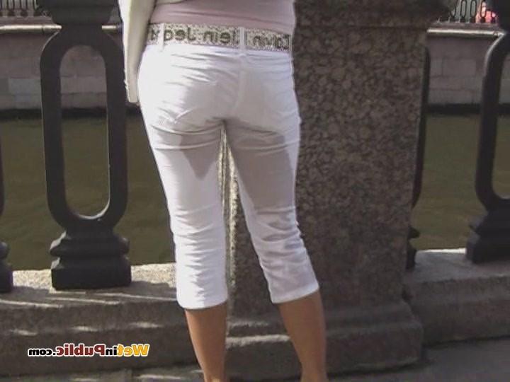 15P Cute blondie soaks her white jeans with piss right in the busy street