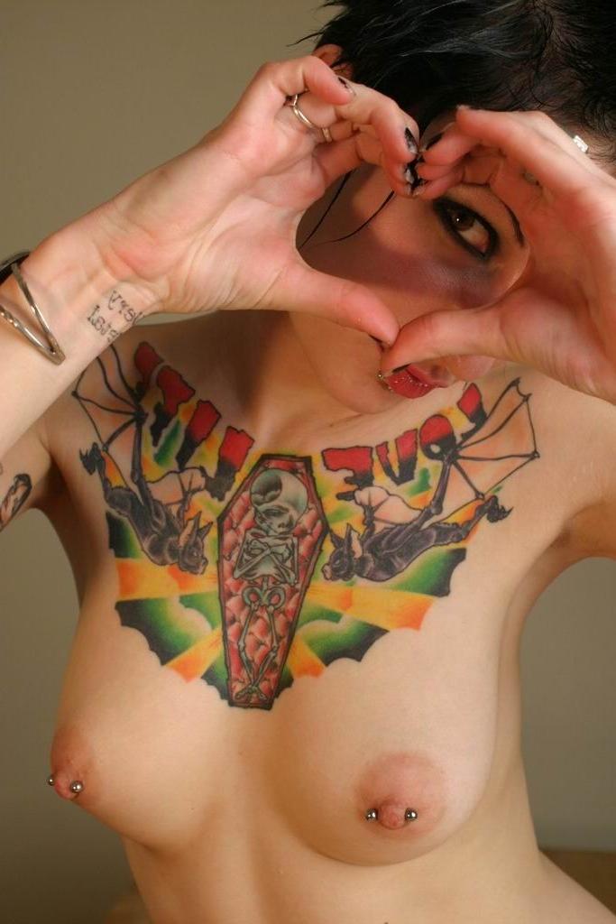 16P Punk girl shows her collection if intimate tattoos and piercings