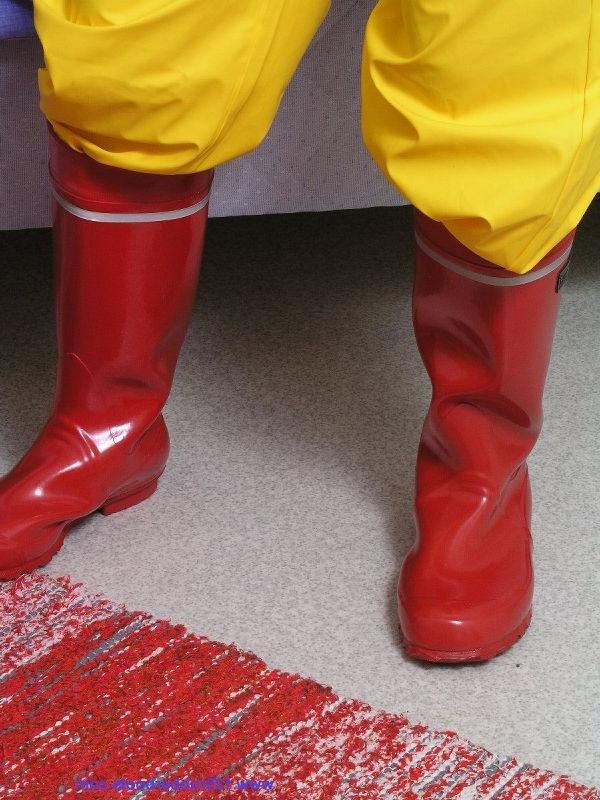 20P Girl with big tits enjoys her rubber rainwear
