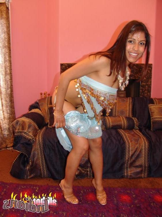 15P Cutie Indian bitch strips lascivious and shows her fuckable booty
