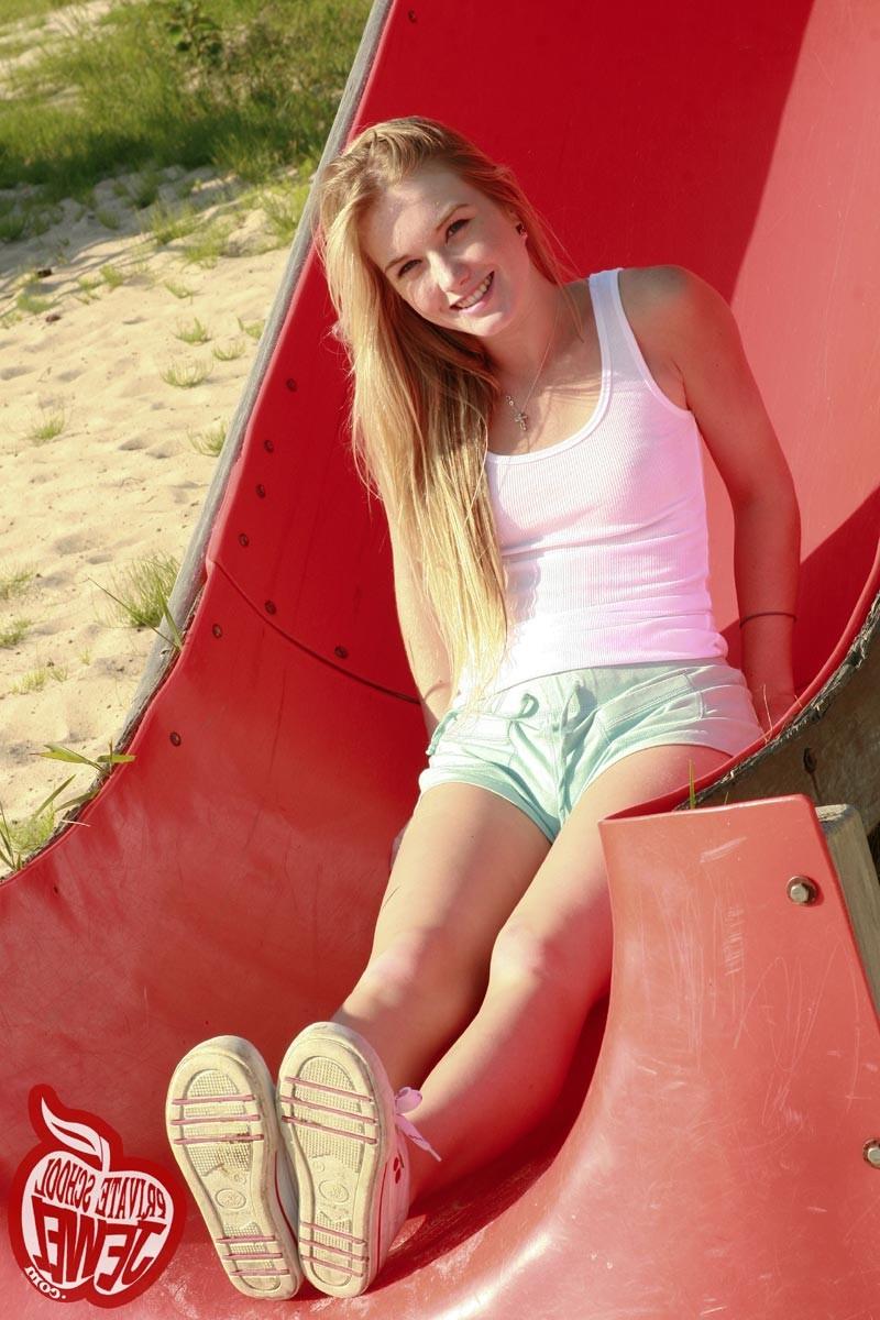 16P Cute teen shows small boobies on playground