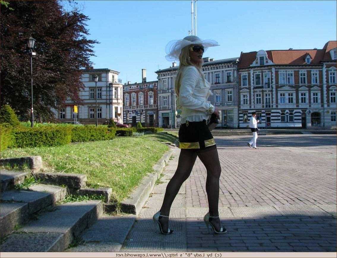12P German lady in stockings posing in public