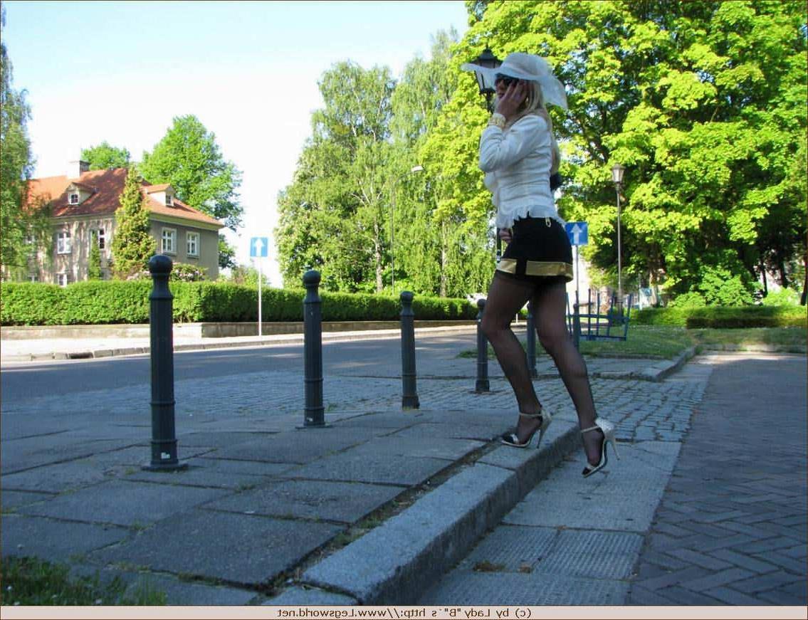 12P German lady in stockings posing in public