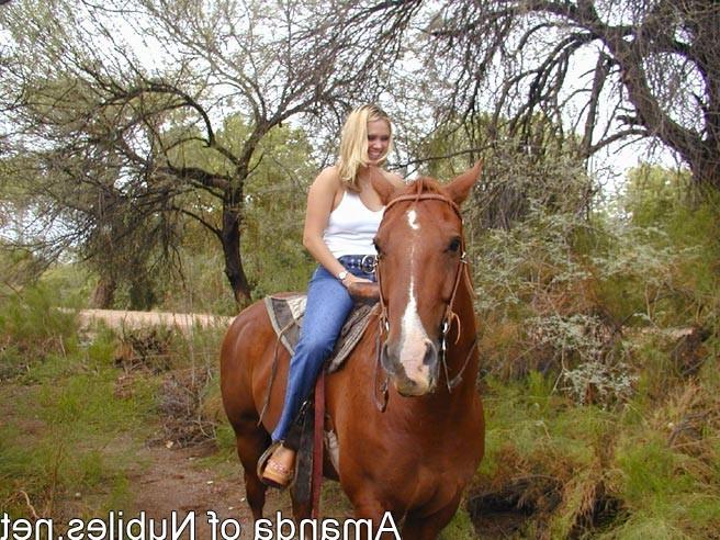 15P Topless blonde on a horse