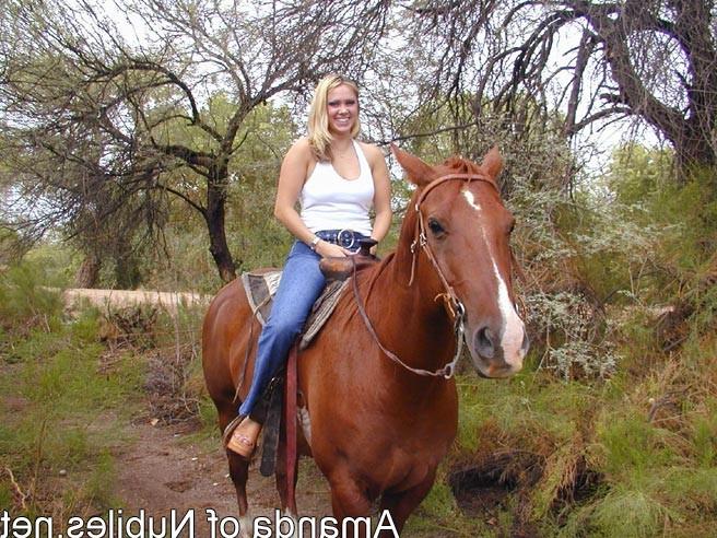15P Topless blonde on a horse