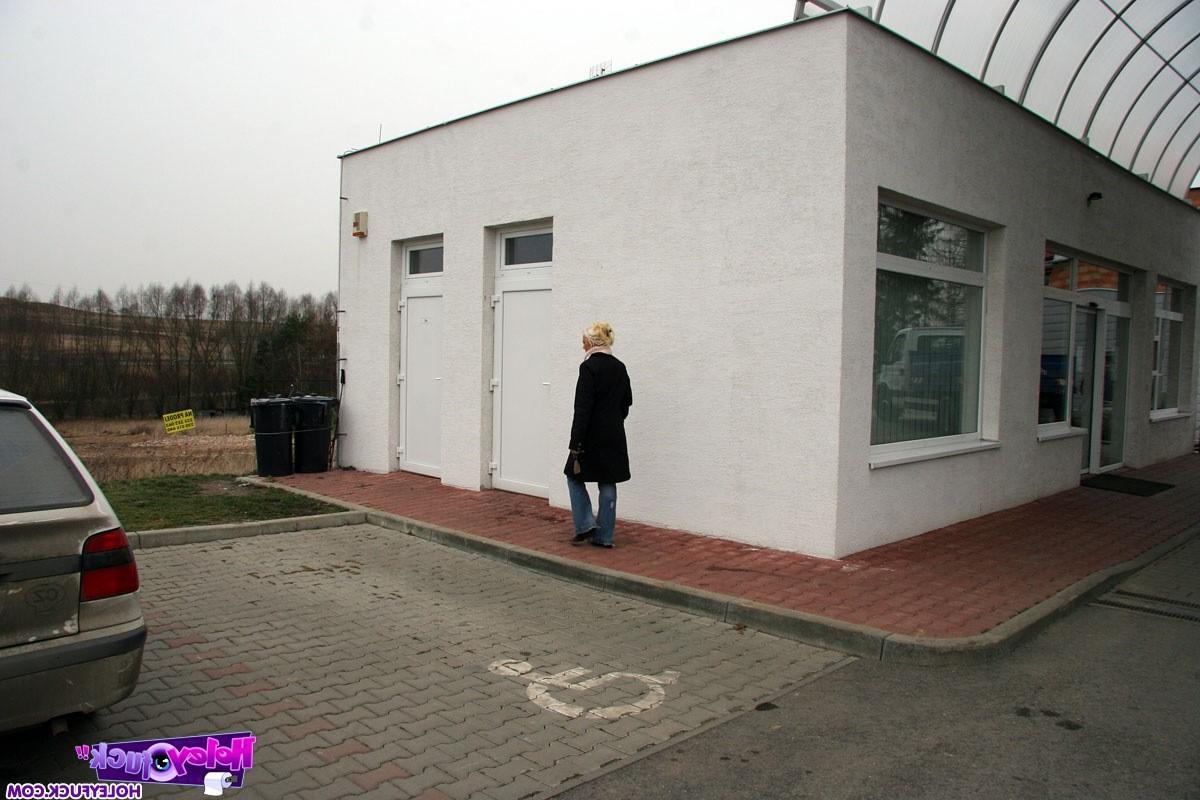 14P Blonde gets surprised with a cock trough the toilet wall