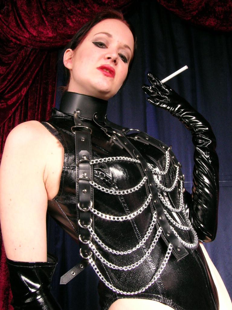 16P Sexy hot mistress wearing only leather smokes long cigarette