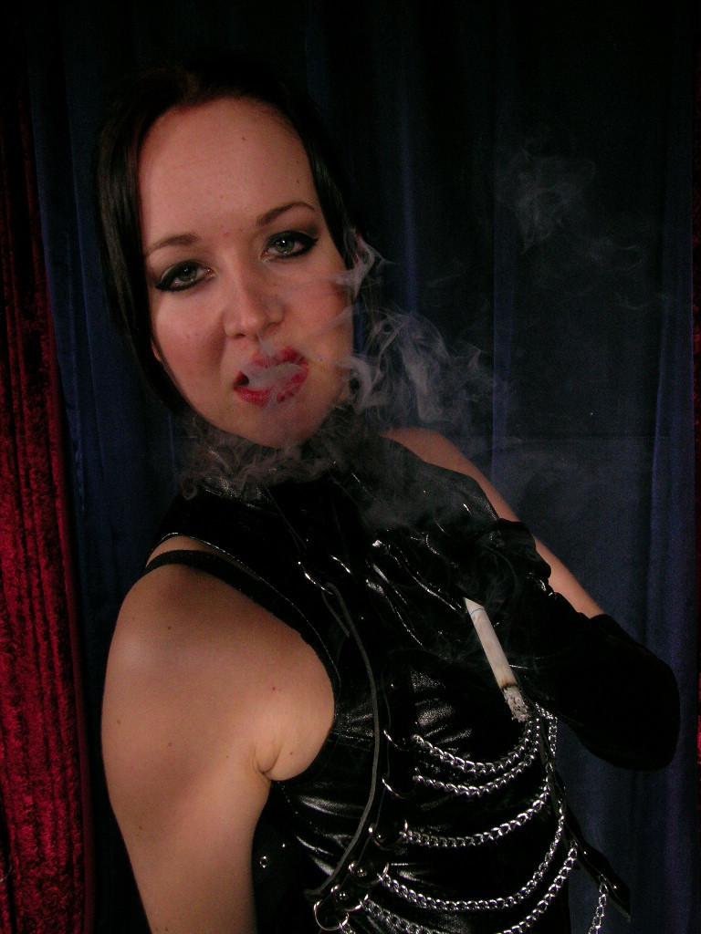 16P Sexy hot mistress wearing only leather smokes long cigarette