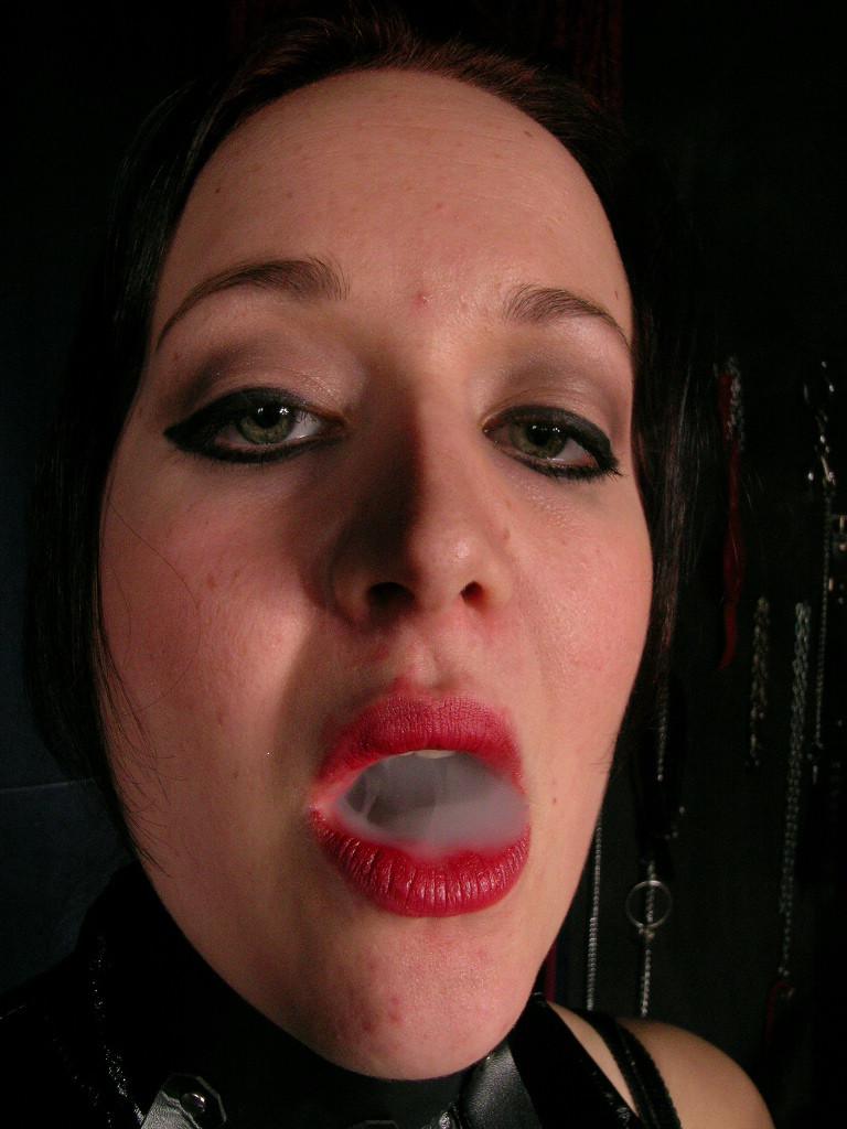 16P Sexy hot mistress wearing only leather smokes long cigarette