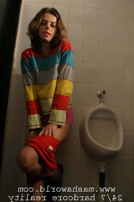 15P Nasty young lady strips in mens toilet