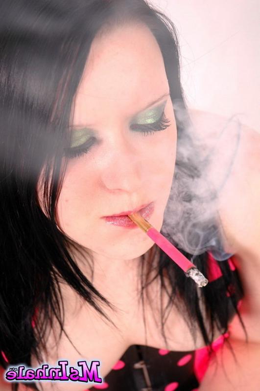 16P brunette teen smoking a pink cigarette