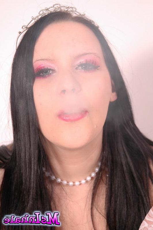 16P brunette teen smoking a cigarette