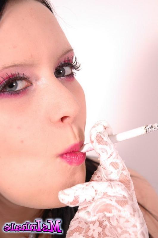 16P brunette teen smoking a cigarette