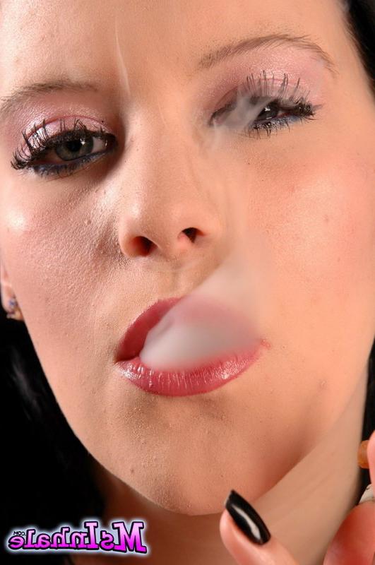 16P brunette teen smoking a cigarette
