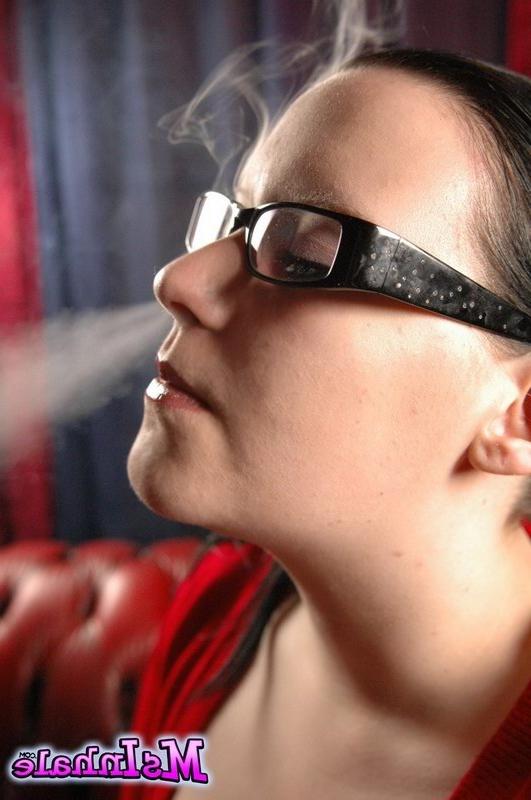 16P teen with glasses smoking a cigarette