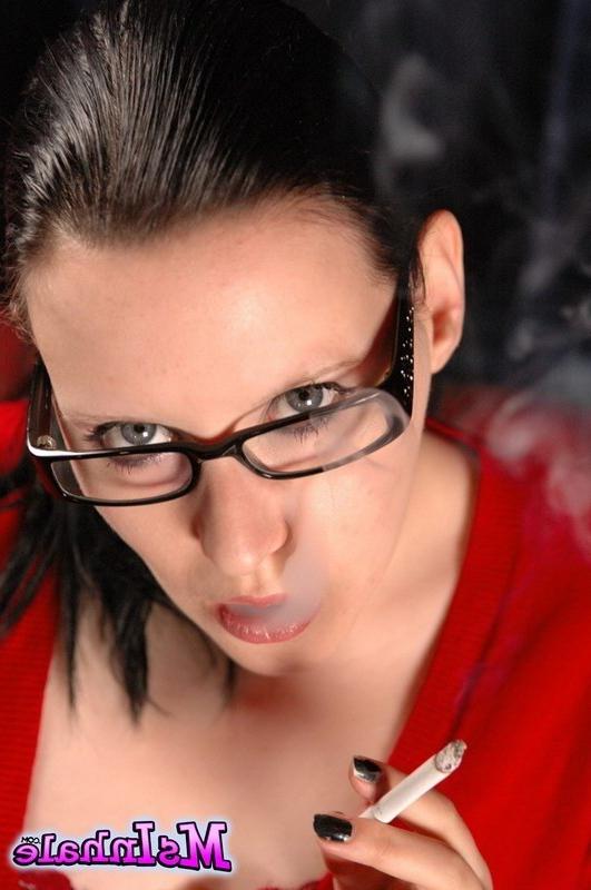16P teen with glasses smoking a cigarette