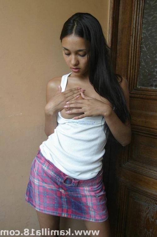 17P Young tanned brunette babe with juicy tits posing nude
