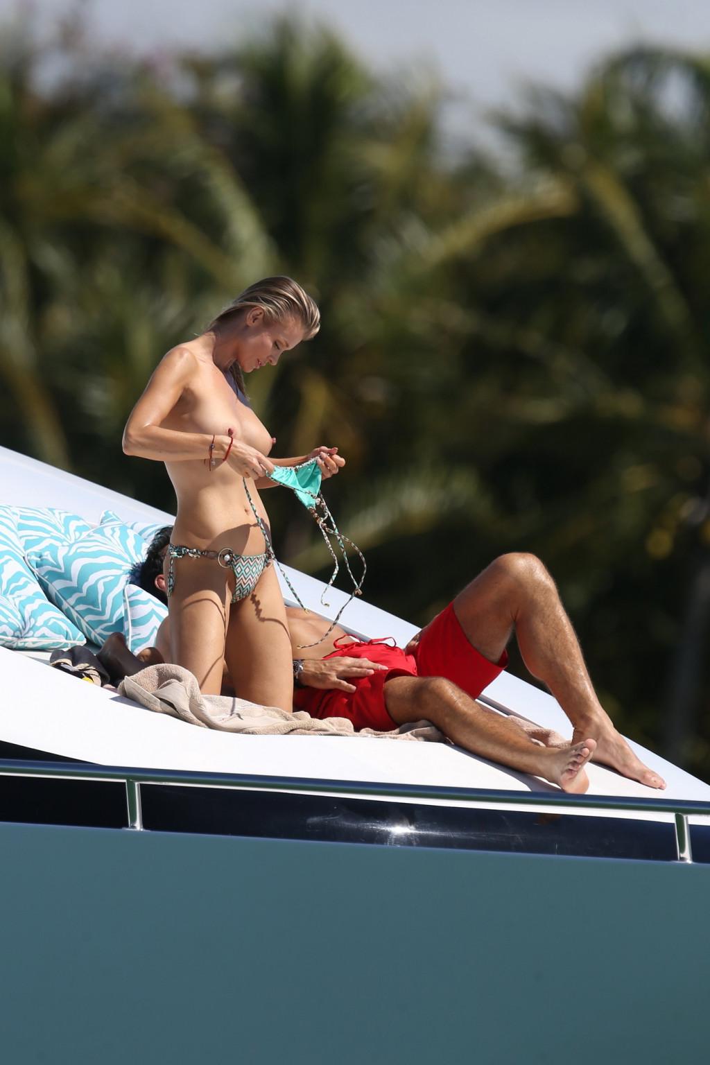 16P Joanna Krupa tanning topless at the yacht in Miami