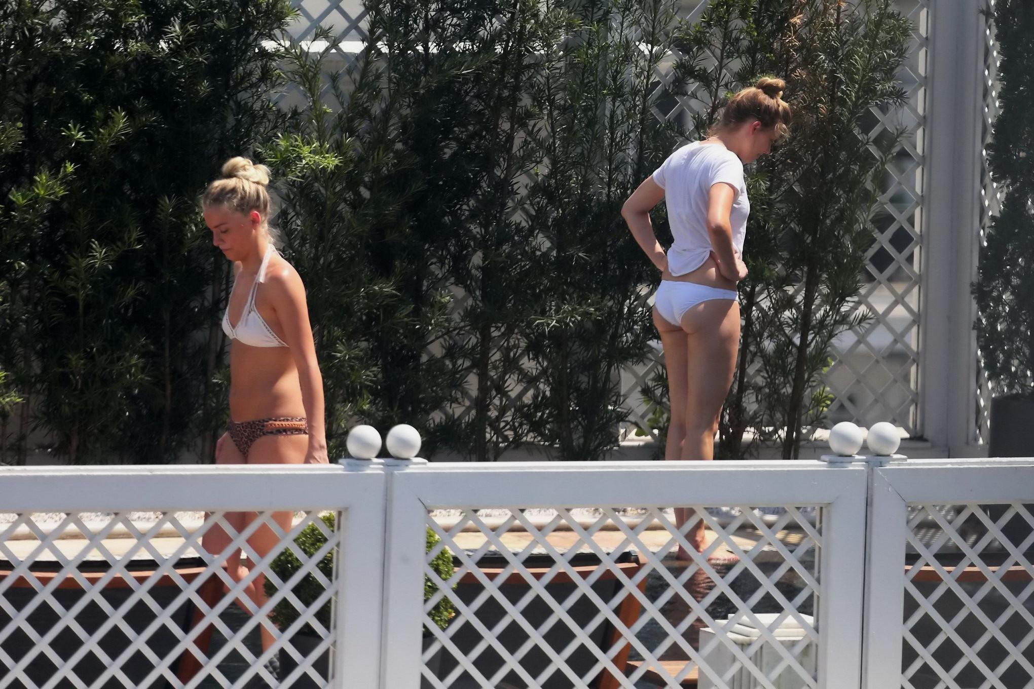 16P Amber Heard shows off her juicy bikini ass poolside