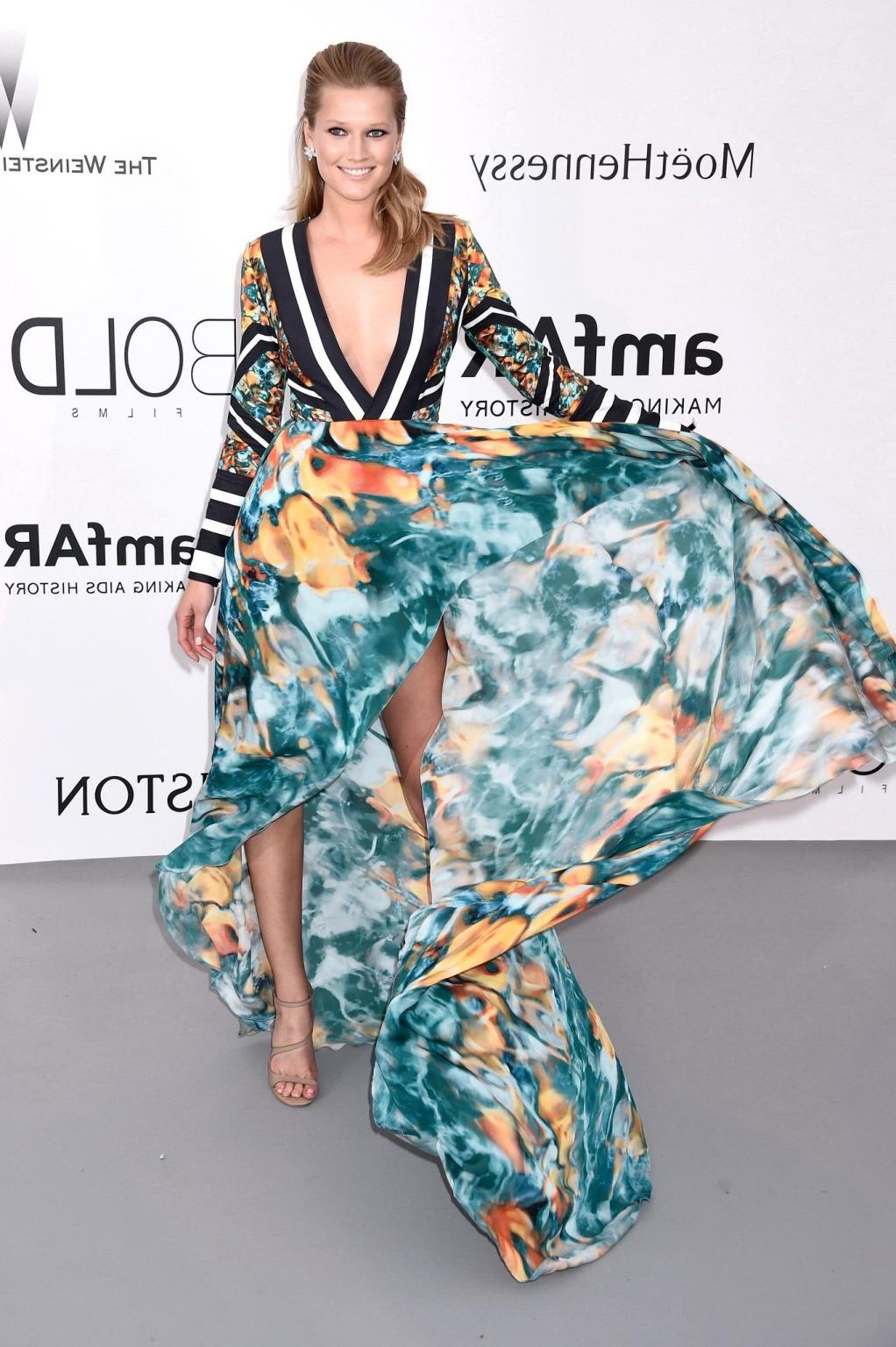 16P Toni Garrn leggy  braless wearing a wide open dress at amfARs 22nd Cinema Agains
