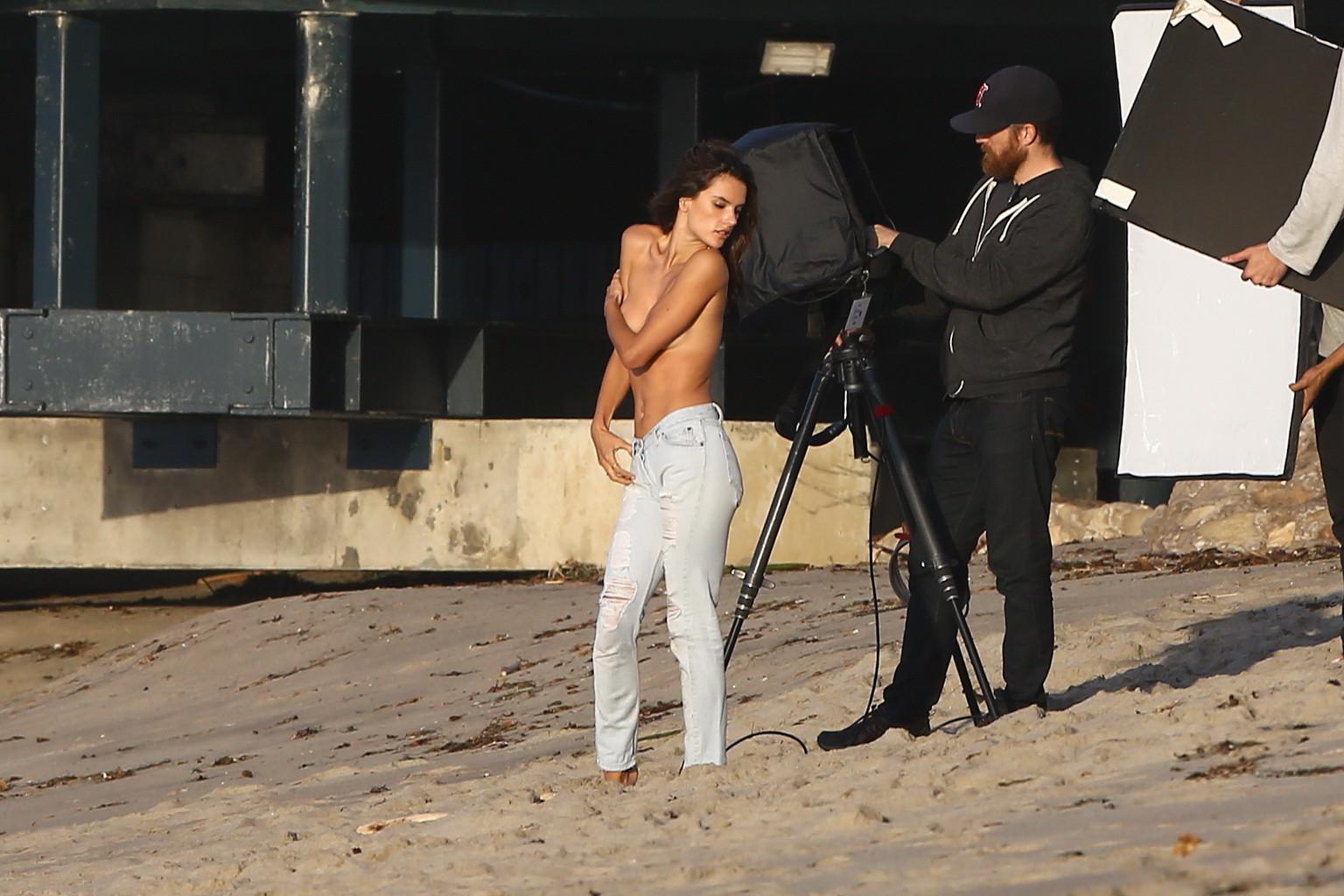 16P Alessandra Ambrosio topless trying to hide her big boobs while shooting at the b