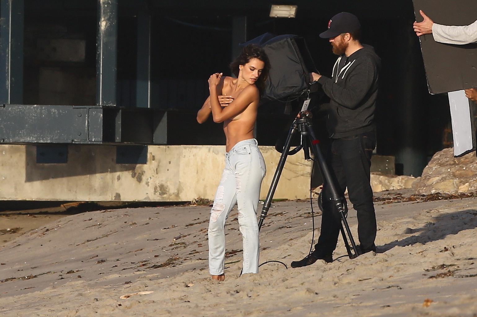 16P Alessandra Ambrosio topless trying to hide her big boobs while shooting at the b