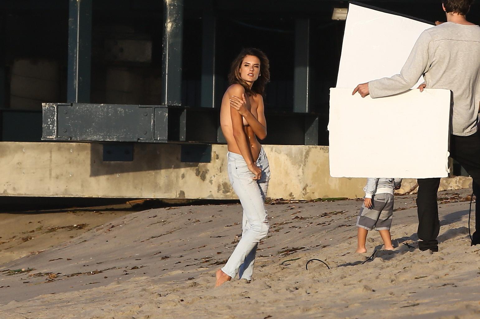 16P Alessandra Ambrosio topless trying to hide her big boobs while shooting at the b