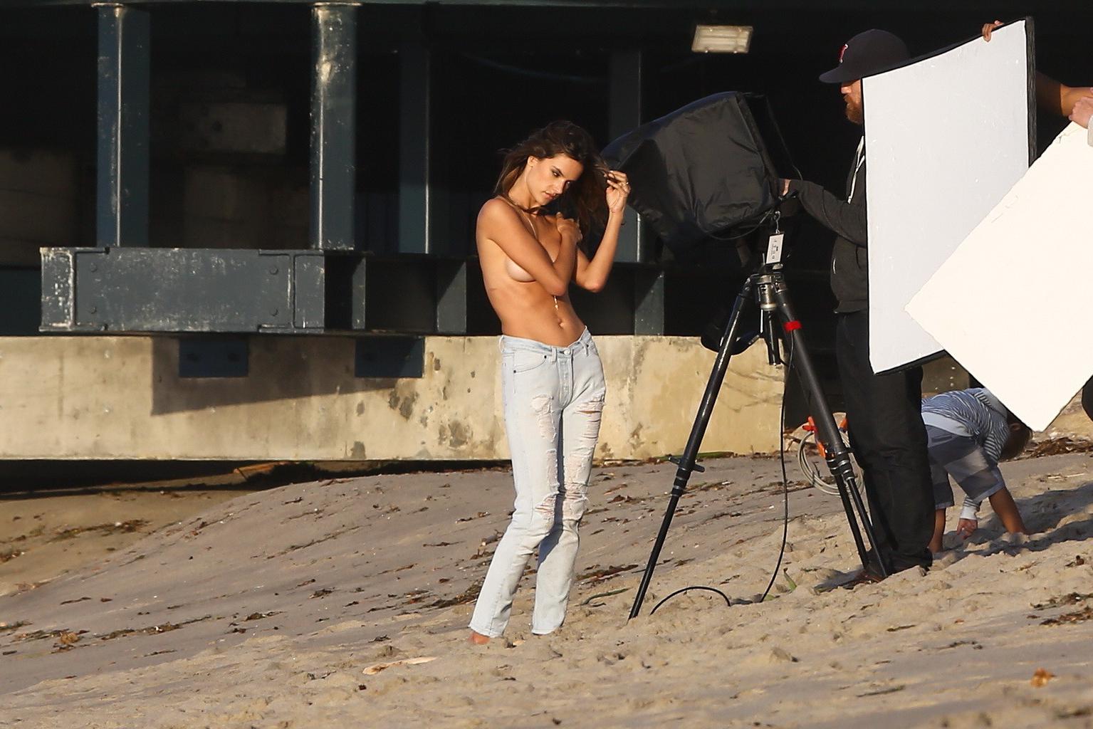 16P Alessandra Ambrosio topless trying to hide her big boobs while shooting at the b
