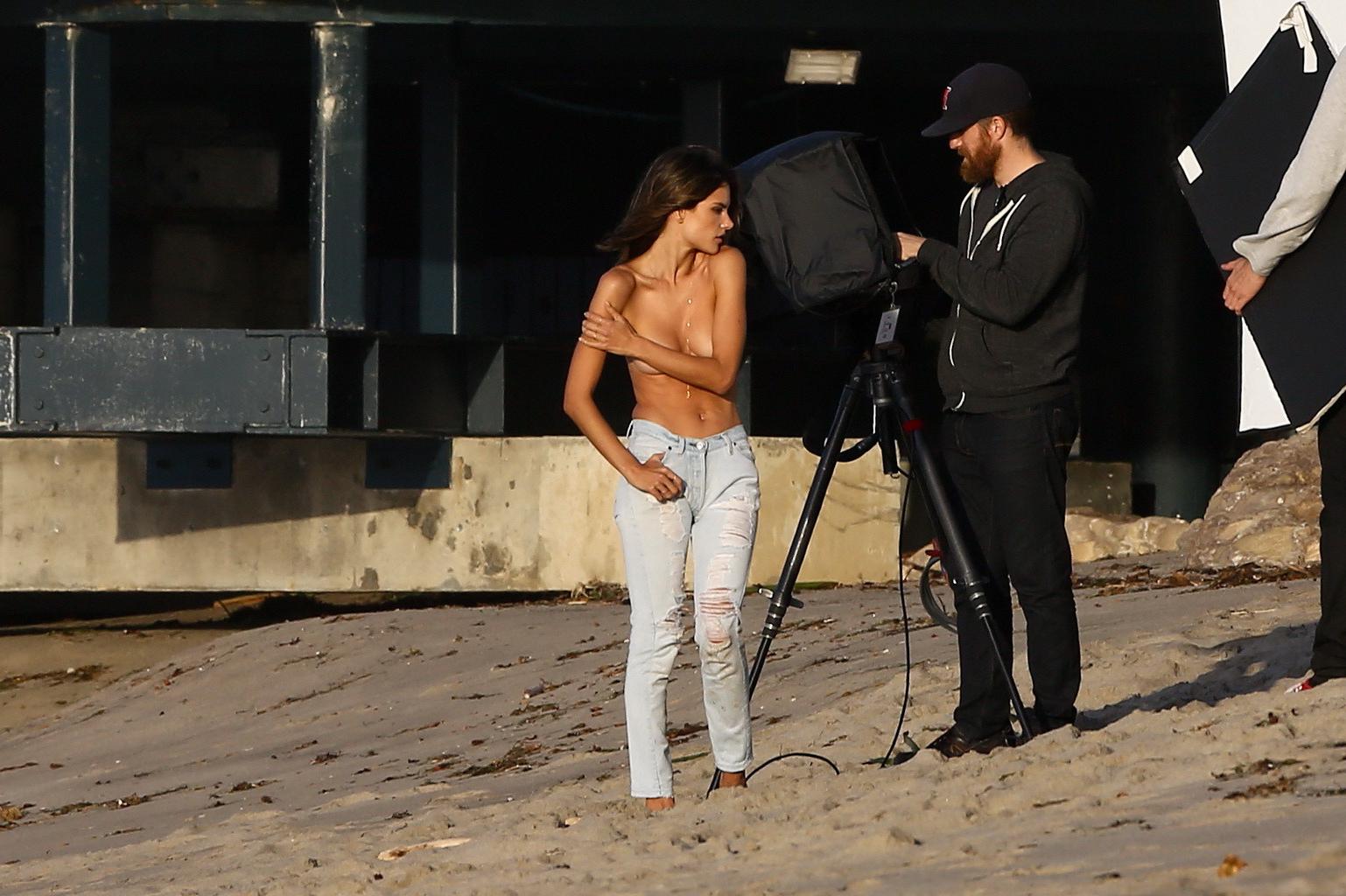 16P Alessandra Ambrosio topless trying to hide her big boobs while shooting at the b