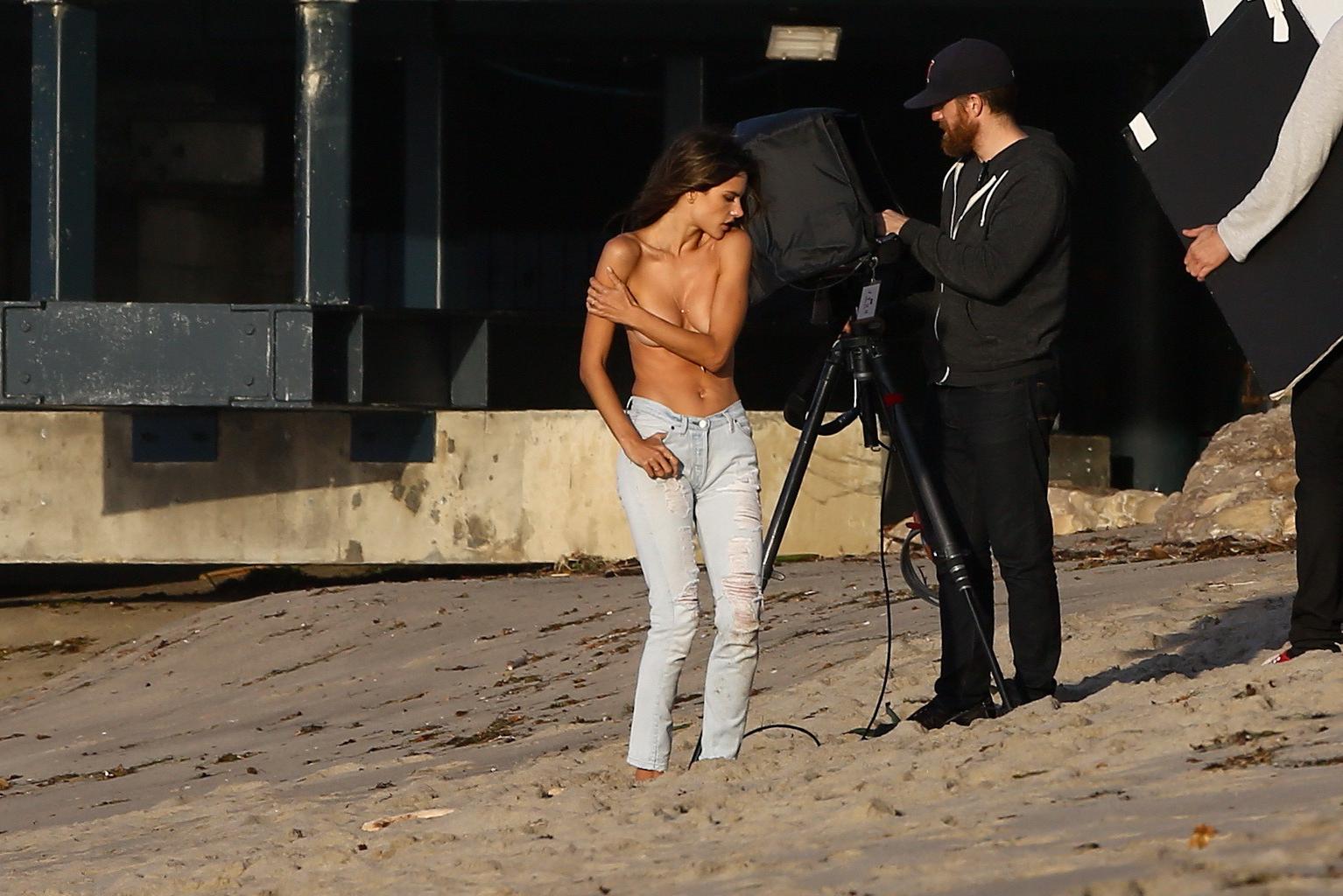 16P Alessandra Ambrosio topless trying to hide her big boobs while shooting at the b