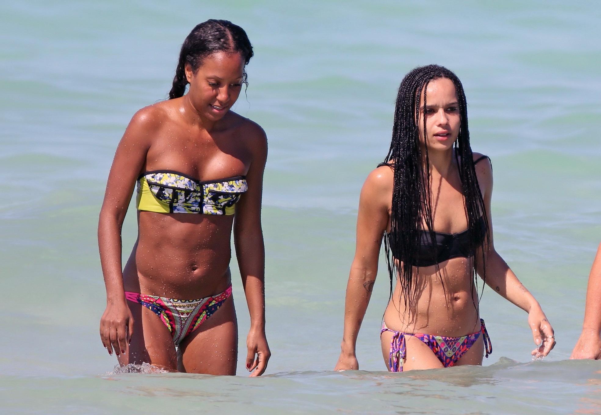16P Zoe Kravitz showing her juicy ass in tiny tube bikini at a beach in Miami