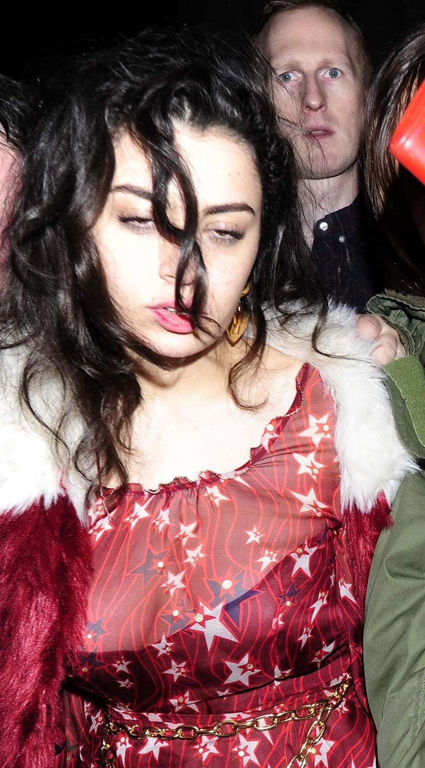 16P Charli XCX busty and braless leaving The Warner Music BRIT Party in London