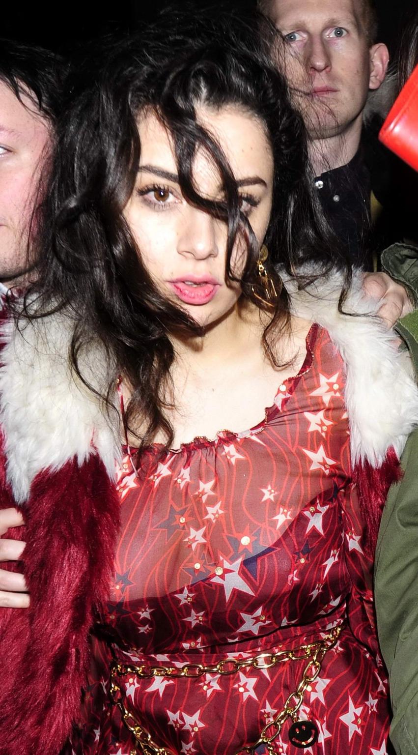 16P Charli XCX busty and braless leaving The Warner Music BRIT Party in London
