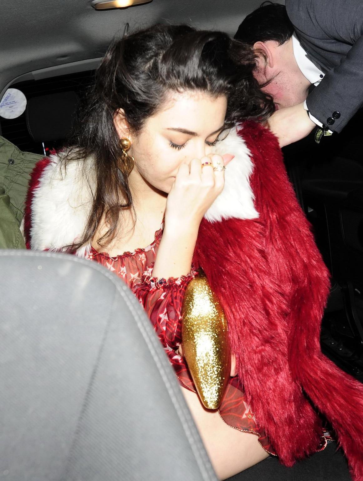 16P Charli XCX busty and braless leaving The Warner Music BRIT Party in London
