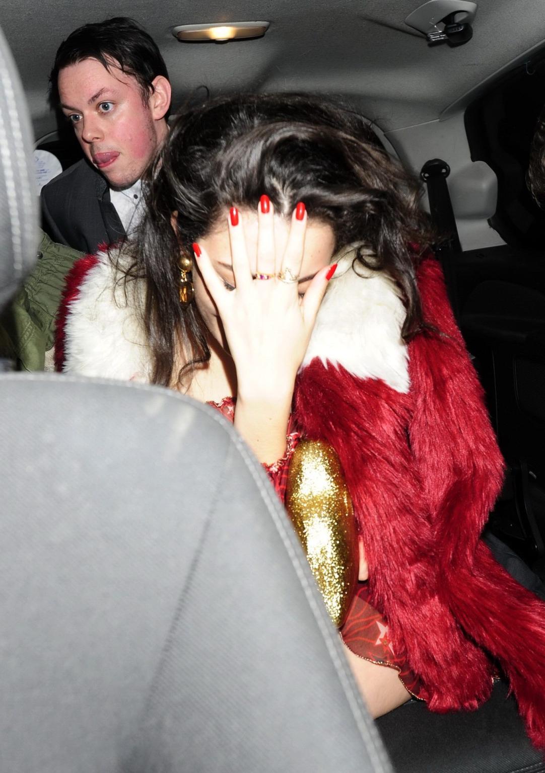 16P Charli XCX busty and braless leaving The Warner Music BRIT Party in London