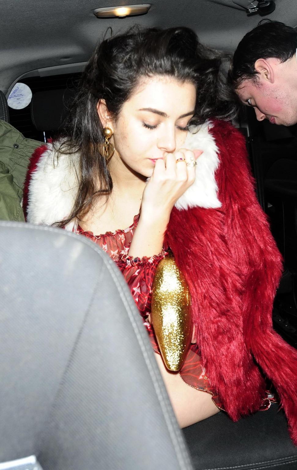 16P Charli XCX busty and braless leaving The Warner Music BRIT Party in London